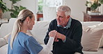 Caregiver, comfort and old man in home with cane, discussion and empathy for rehabilitation. Smile, female nurse and senior person with disability, assisted living and walking stick for physiotherapy
