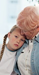 Face, grandma and hug sick child in hospital for healing support, emotional comfort and bonding. Family, girl patient and elderly woman with embrace for pediatric visit, recovery care and compassion