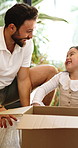 Father, child and moving in new house with unpacking, assistance and happy for property investment. Smile, man and daughter in dream home with cardboard box, bonding or mortgage loan for real estate.