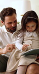 Father, child and conversation in home with tablet, education and learning to play online game together. Man, daughter and relax in living room with tech, discussion and knowledge for gaming website.