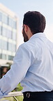 Thinking, back and business man in city for reflection, property developer and real estate agent. Perspective, realtor growth and opportunity with person on bridge outdoor for commute and planning