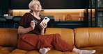 Excited, woman and phone in house with credit card, online shopping payment and discount for purchase. Happy, mature person and digital banking on couch with fintech, ecommerce website and savings.