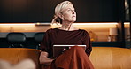 Tablet, thinking and woman on sofa in home for reading online blog or social media post in living room. Digital technology, planning and mature person with website for news or research in apartment.