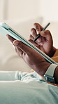 Tablet, pen and hands of man on sofa in home for remote work with web development for online research. Technology, stylus and programmer with software update, system maintenance or app project.
