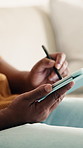 Tablet, stylus and hands of man on sofa in home for remote work with web development for online research. Technology, pen and programmer with software update, system maintenance or app project.