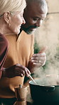 Cooking, interracial couple or smell food in house for broth flavor, spice fragrance or high five. Meal prep, mature people or supper aroma with celebration for recipe scent, homemade dish or support