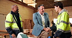 Architecture, timber or people in factory with handshake, deal or negotiation success as furniture vendor. Team, client or contractor with shaking hands, partnership or supplier agreement in woodwork