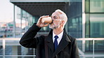 Mature, businessman and drinking coffee in city with commute, attorney and planning for court case. Corporate lawyer, person and thinking in urban town with tea, legal aid idea or travel to law firm.