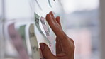 Hands, glass wall and sticky note at office with project management, planning or review at startup. Person, paper and link for solution, proposal or problem solving with schedule at creative agency