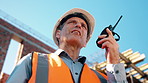 Construction, radio and thinking with man outdoor for planning, property development or vision. Communication, hardhat and talking with mature developer on building site for architecture from below