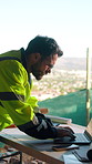 Construction, laptop and typing with man on building site for planning or property development. Computer, glasses and research with developer person on worksite for architecture or project management