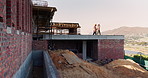 Engineering, people and plan at construction site with building inspection, discussion or strategy. Engineer, team and talk with project collaboration, quality assurance or outdoor for infrastructure