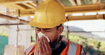 Construction site, man and sneeze with illness for building, renovation and civil engineering fatigue. Sick contractor, tissue and burnout with industrial debris, architecture or maintenance dust