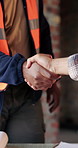 Construction, architect and shaking hands for deal, infrastructure partnership or collaboration. People, architecture and handshake for thank you, development agreement or success at building site