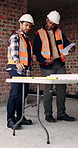 Construction, blueprint and men with checklist on site for building layout, inspection and team. Floor plan, manager or architect with clipboard for project timeline, quality assurance and compliance