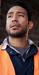 Helmet, thinking or man with stress at construction site, overwhelmed or renovation project pressure. Vision, safety gear or tired worker with burnout for building workload, below or remodel deadline