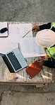 Blueprint, man and construction worker with laptop on site for planning home renovation from above. Floor plan, computer and male civil engineer with research for repairs, maintenance or building.