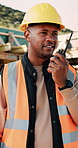 Construction, talking and black man with radio at site for communication, feedback and update. Architecture, engineering and person with instructions for building plan, renovation and infrastructure