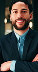 Arms crossed, face and smile of business man in office for financial career or consulting. Confidence, corporate and friendly with happy broker in workplace for banking, finance or investment advice
