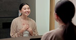 Affirmations, talking and woman by mirror in bathroom at house with self love, confidence or grooming. Happy, reflection and Asian female person with wellness routine, benefits or beauty motivation.