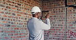Photography, inspection and black man with tablet at construction site, compliance or review. Back, space evaluation and person with tech screen for wiring, installation or electrical line picture
