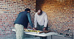 Conversation, team and architect with blueprint for construction, planning or idea for site integration. Review, property development or men with document for infrastructure, talk or engineering