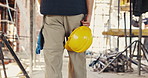 Helmet, hands and man on construction site for safety, infrastructure and property inspection. Architecture, civil engineering and walking with PPE equipment, renovation and remodeling project
