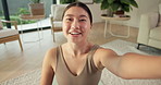 Vlogging, happy and face of woman in home with with interaction with followers for subscription. Smile, Asian person and portrait of female influencer with content creation in living room at house.