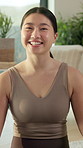 Face, smile and Asian woman in home, yoga and healthy routine for holistic healing. Apartment, yogi and Japanese person in living room, chakra and morning with happiness, mindfulness and wellness
