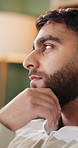 Man, thinking and regret with doubt in home for past moment, mistake or mental health. Thoughtful, male person or vision with stress, concern or contemplation for bad history or rumination in house