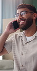 Phone call, happy and man in home with remote work on software development with contact for feedback. Laugh, cellphone and male web designer on mobile discussion for review on programming project.
