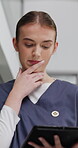 Healthcare, tablet and thinking with nurse in hospital at night for planning, report or research. App, feedback and medical history with woman in dark clinic for assessment, diagnosis or review
