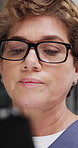 Nurse, woman and reading in hospital with tablet, glasses and healthcare research report at night. Late, mature person and medical worker in clinic with tech, telehealth website or email notification