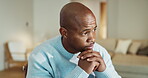 Mental health, thinking or black man in home with worry, regret and memory of past trauma. Guilt, space or male person in house with reflection, overthinking and flashback doubt in living room.