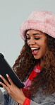 Online, girl and laugh with tablet in studio for funny celebrity gossip, social media meme and post. App, gen z person and happy with tech on white background for comedy video, internet joke or humor