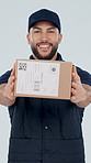 Box, smile and face of deliveryman in studio with confidence for distribution service with sticker. Smile, cardboard parcel and portrait of male logistics worker with package by white background.