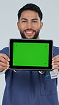 Nurse, face and man with tablet,  green screen and health website promotion and confident in studio. White background, medical specialist and happy person with tech, online or telehealth presentation