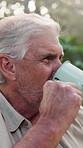 Coffee, thinking and senior man in nature for camping, holiday or getaway on break for retirement. Relax, outdoor and elderly male person drinking cappuccino with reflection in woods for weekend trip