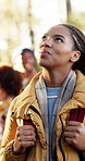 Thinking, hiking and woman in nature with friends for holiday scenery, adventure or exploration. Sightseeing, trekking or person in forest for trip, walk or travel with reflection on group expedition