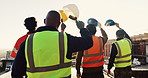 Engineer, team and raised hand with hardhat for construction, safety and ppe for project success. Back, people and waving outdoor for awareness, appreciation and celebration of architecture milestone