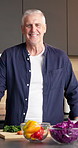 Face, cooking and senior man in kitchen with vegetables for healthy diet, chopping board or nutrition. Portrait, elderly person and meal prep at home, organic ingredients and laugh in retirement
