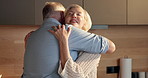 Love, hug and old couple in home for support, comfort or bonding together in kitchen. Smile, commitment and senior man with woman for romance with marriage, anniversary and embrace in apartment