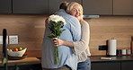 Smile, flowers and old couple in home for hug, support or bonding together in kitchen. Love, commitment and senior man with elderly woman for gift with marriage, anniversary and bouquet in apartment