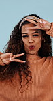 Excited, dancing and face of woman in studio with winning, bonus or good news with music. Happy, energy and portrait of person with groove to playlist for celebration of promotion by blue background.
