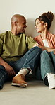 Couple, relax and floor at house with smile, love and bonding together for commitment. Happy, African people and laughing in lounge with partner, funny joke and connection for healthy relationship