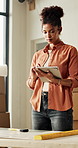 Tablet, renovation and woman in home, typing and digital app for email, interior design or texting. Apartment, tech and person in lounge, blueprints or connection for social media and online schedule