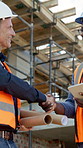 Handshake, architect and team with men on construction site for contractor, remodeling update and blueprint. Shaking hands, engineer feedback and floor plan with people at building inspection