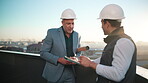 Construction, tablet and talking with men on rooftop for city planning or project management. App, conversation and hardhat with architect team outdoor for property, real estate or urban development