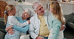 Smile, children and hug with grandparents in home for care, support or connection with generations. Girls, chat and embrace with senior people in living room for family bonding, love and reunion