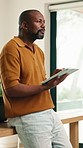 Remote work, thinking and man in home on tablet for internet, networking and website for research. Mature, house and African person on digital tech for online report, proposal and freelance project